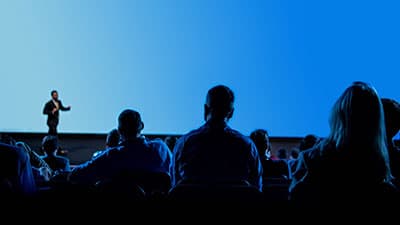 Team collaborating after a motivational speech