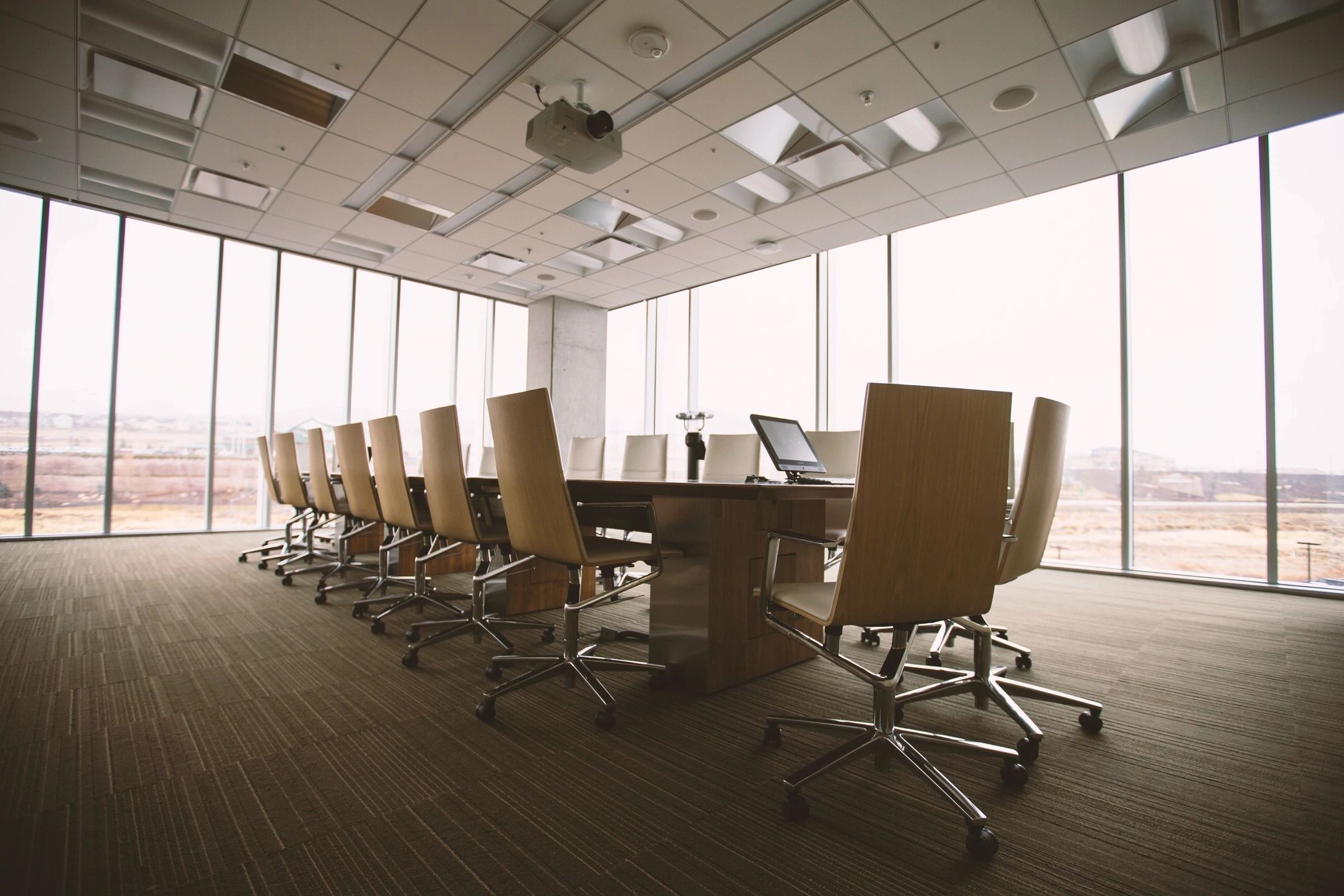 A conference room with chairs and tables in it