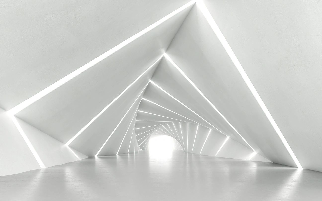 A white room with a light shining through the ceiling.