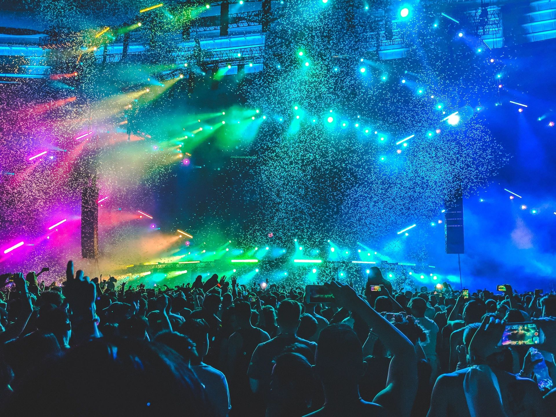 A crowd of people in front of a stage.